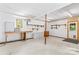 Spacious basement featuring a workbench, cabinets, and shelving for ample storage at 265 River Run Rd, Statesville, NC 28625