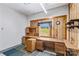 Finished basement area includes a built-in desk, drawers, and shelving at 265 River Run Rd, Statesville, NC 28625