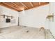 Unfinished basement with concrete floor, exposed ceiling, and shelf storage at 265 River Run Rd, Statesville, NC 28625