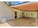 Expansive wooden deck offers ample space for outdoor entertaining, blending seamlessly with the home's exterior at 265 River Run Rd, Statesville, NC 28625