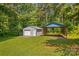 Durable outbuilding features garage, covered parking, and ample storage space at 265 River Run Rd, Statesville, NC 28625