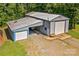 This large outbuilding features multiple garage doors, offering ample storage and workspace at 265 River Run Rd, Statesville, NC 28625