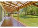 Enjoy the scenery from this relaxing porch with wooden floors and nature views at 265 River Run Rd, Statesville, NC 28625