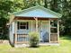 Charming Shed with cozy covered porch, a perfect place for relaxation or a hobby space at 265 River Run Rd, Statesville, NC 28625