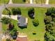 Aerial shot of home featuring expansive backyard, well-maintained lawn, mature trees, deck and storage shed at 2906 Plantation Way, Albemarle, NC 28001