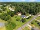 Overhead view showcases this home's mature trees, grassy lawn and its location in a quiet residential neighborhood at 2906 Plantation Way, Albemarle, NC 28001