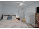Comfortable bedroom with a bed, ceiling fan, and two closets, providing ample storage at 2906 Plantation Way, Albemarle, NC 28001