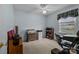 Bedroom with a window, ceiling fan, desk, and storage; suitable for a home office or room at 2906 Plantation Way, Albemarle, NC 28001