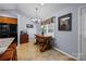 Dining area features rustic wood table and easy access to black refrigerator, tile flooring at 2906 Plantation Way, Albemarle, NC 28001