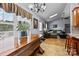 Dining area features views, natural light, access to Gathering room, and rustic wood table at 2906 Plantation Way, Albemarle, NC 28001