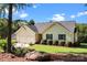 Charming single-story home with a two-car garage, well-manicured lawn, and colorful landscaping at 2906 Plantation Way, Albemarle, NC 28001