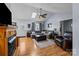 Bright living room with vaulted ceilings, hardwood floors, and a fireplace at 2906 Plantation Way, Albemarle, NC 28001