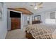 Spacious main bedroom with exposed wood beam and large windows, providing ample natural light at 2906 Plantation Way, Albemarle, NC 28001