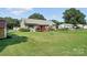 Spacious backyard with a deck, garden, and ample green space at 29636 Lakeside Dr, Albemarle, NC 28001