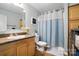 Functional bathroom features a vanity, toilet, shower-tub combo, and storage at 29636 Lakeside Dr, Albemarle, NC 28001