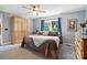 Cozy bedroom with neutral walls, ceiling fan, and natural light from the window at 29636 Lakeside Dr, Albemarle, NC 28001