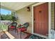 Welcoming front porch with seating, a cozy atmosphere, and a decorative front door at 29636 Lakeside Dr, Albemarle, NC 28001