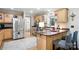 Well-lit kitchen featuring stainless steel appliances and a breakfast bar with seating at 29636 Lakeside Dr, Albemarle, NC 28001