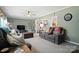 Inviting living room featuring comfortable seating, neutral decor, and ample natural light at 29636 Lakeside Dr, Albemarle, NC 28001