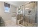 Modern bathroom with glass shower, soaking tub, and stylish tile at 3136 Beacon Heights Rd, Indian Land, SC 29707