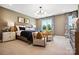 A spacious bedroom showcases stylish decor, including comfortable chairs and a striking contemporary light fixture at 327 Ardmore Dr, Belmont, NC 28012