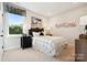 A trendy bedroom features a modern bed frame and artistic wall decor at 327 Ardmore Dr, Belmont, NC 28012