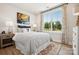 A bright bedroom is decorated with an eclectic carpet and a modern art print at 327 Ardmore Dr, Belmont, NC 28012