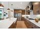 Spacious kitchen with stainless steel appliances, island with a farmhouse sink, and ample cabinet space at 327 Ardmore Dr, Belmont, NC 28012