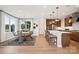 Open-concept kitchen with stainless appliances, island with breakfast bar, and adjacent dining area, perfect for modern living at 327 Ardmore Dr, Belmont, NC 28012