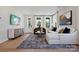 Bright and airy living room with hardwood floors, neutral decor, and large windows at 327 Ardmore Dr, Belmont, NC 28012
