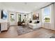Inviting living room with stylish furniture, area rug, and natural light streaming through multiple windows at 327 Ardmore Dr, Belmont, NC 28012