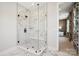 This glass shower has a built-in seat and beautiful marble tile at 327 Ardmore Dr, Belmont, NC 28012