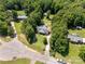Aerial view of the property with lush greenery, swimming pool, outbuilding, and a long driveway at 4030 Orion Rd, York, SC 29745