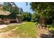 Expansive backyard featuring a wooden deck, playground, and lush green grass, ideal for outdoor enjoyment at 4030 Orion Rd, York, SC 29745