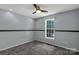 Bedroom featuring neutral carpet, a ceiling fan, and a window at 4030 Orion Rd, York, SC 29745