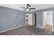 Bedroom with ceiling fan, carpet and an adjoining bathroom and closet at 4030 Orion Rd, York, SC 29745