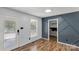 Living room with wood-look flooring and accent wall design at 4030 Orion Rd, York, SC 29745