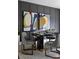 Dining room with modern decor including abstract art, stylish gray chairs, and a striking black table at 4114 Lattistep Ln, Charlotte, NC 28269