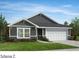 Charming single-story home featuring stone accents, horizontal siding, and a two-car garage at 4461 Family Trail Dr, Indian Land, SC 29707