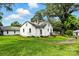 Spacious backyard with mature tree, lush green grass, and detached structure at 450 1St Se St, Hickory, NC 28602