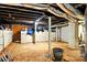 Unfinished basement area with cement flooring, brick walls, and storage space available at 450 1St Se St, Hickory, NC 28602