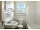 Bathroom featuring a vintage sink, toilet, and bathtub with shower at 450 1St Se St, Hickory, NC 28602