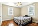 Bedroom with hardwood floors, ceiling fan and two windows that let in natural light at 450 1St Se St, Hickory, NC 28602