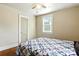 Bedroom featuring hardwood floors and a window that lets in natural light at 450 1St Se St, Hickory, NC 28602