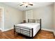Bedroom featuring hardwood floors and natural light with a metal frame bed at 450 1St Se St, Hickory, NC 28602