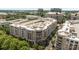 Aerial view of a residential and commercial community with balconies, restaurants, and beautiful landscaping at 4625 Piedmont Row Dr, Charlotte, NC 28210