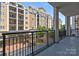 Spacious balcony with railing overlooking the city and surrounding buildings at 4625 Piedmont Row Dr, Charlotte, NC 28210