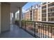 Balcony with railing overlooking the city and surrounding buildings at 4625 Piedmont Row Dr, Charlotte, NC 28210