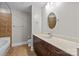 Bathroom with tiled shower, vanity, and mirror at 4625 Piedmont Row Dr, Charlotte, NC 28210