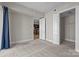 Carpeted bedroom with view of kitchen and walk-in closet at 4625 Piedmont Row Dr, Charlotte, NC 28210